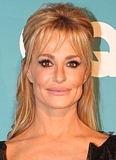 Taylor Armstrong in 2012. A screenshot of her in The Real Housewives of Beverly Hills serves as the meme's left image. Taylor Armstrong headshot.jpg
