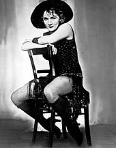 Marlene Dietrich as Lola: She straddles a chair...imperiously, magisterially, fully the measurer of men in the audience...[7]