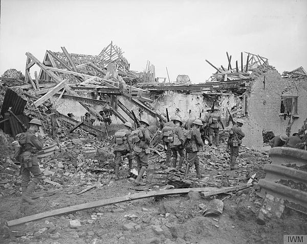 A patrol of 1/19th Londons moves through a shattered village near Ypres, 27 August 1917