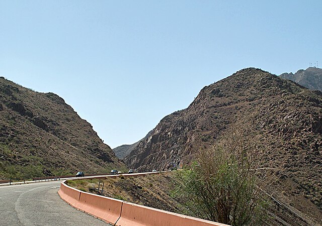 The largest road cut on Transmountain Drive, at the mile-high crest of Smuggler's Pass