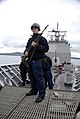 29: US Navy 061023-N-3888C-002 Fire Controlman 2nd Class Jordan A. Holdaway assigned to guided-missile cruiser USS Monterey (CG 61) awaits orders to engage an attacker during a small boat attack drill.jpg