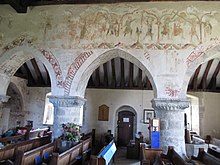 The south arcade with its frescoes West Chiltington church arcade and frescoes.jpg