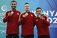 Asil (right) at the Islamic Solidarity Games 5. Islamic Solidarity Games 2021 Konya Men Gymnastics Team Medal Ceremony Turkey Team 20220810.jpg