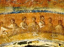 Fractio panis, in the Catacombs of Rome Agape feast 05.jpg