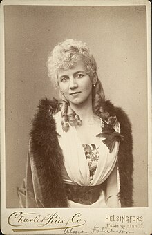 Headshot of Fohström in formal dress and curled hair.