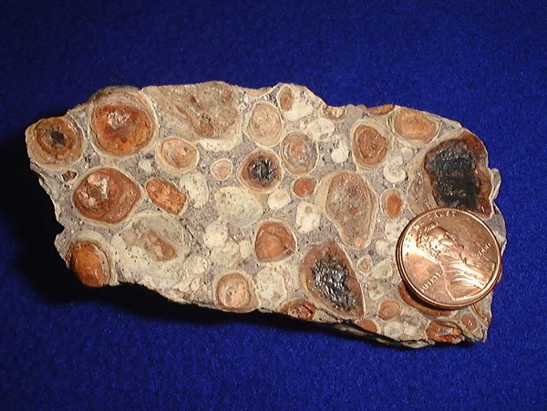 Bauxite with US penny for comparison