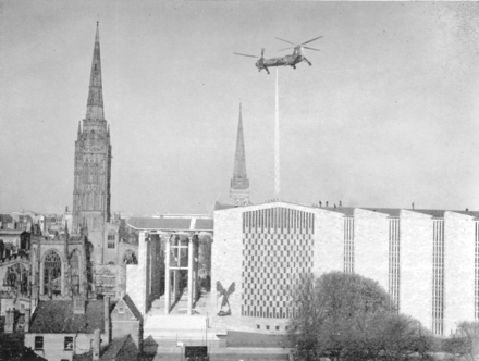 A helicopter placing the Flèche (spire) on top of the new Coventry Cathedral in 1962.