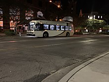 The Nite Nole charging on its layover at the UCA bus stop. Bus charging at doak.jpg