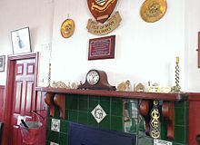 The restored waiting room with period detail and coal fire Castletown Waiting Room.jpg