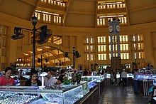 Jewellers in the Central Market of Phnom Penh. Cavernous interior of the PP Central Market (14249112532).jpg
