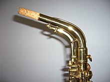 The unusual and distinctive "underslung" octave key mechanism on a Conn 6M "Lady Face" alto saxophone. Conn6M6.JPG