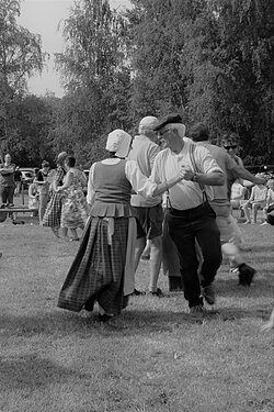 Folk dance at the Maypole planting event