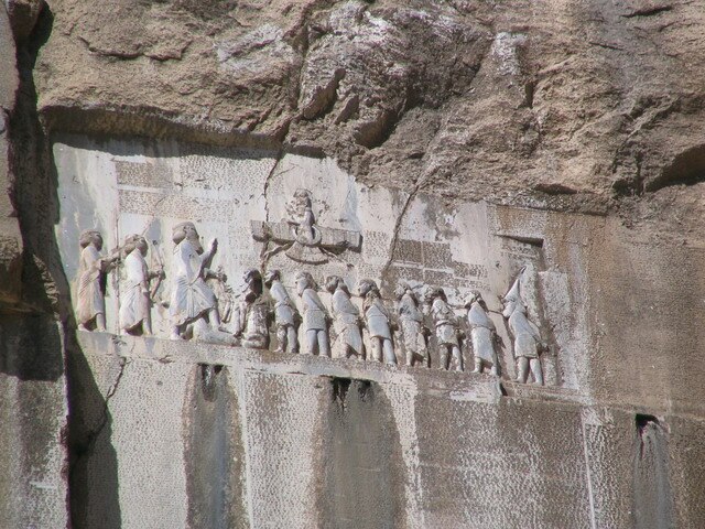 The Bistun Inscription of Darius the Great describes itself to have been composed in Arya [language or script].