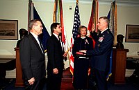 Secretary of Defense Donald Rumsfeld watches as General Richard B. Myers was sworn in as the 15th Chairman of the Joint Chiefs of Staff, October 1, 2001.