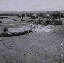 A destroyed helicopter at Camp Holloway Destroyed helicopter at Camp Holloway, 7 February 1965.jpg