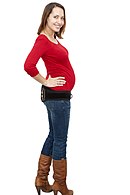 Woman in form fitting maternity clothing