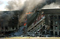 Firefighters work to put out the flames moments after a hijacked jetliner crashed into the Pentagon at approximately 0930 on September 11, 2001 010911-M-CI426-051.jpg