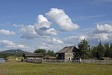 Some of the historic buildings at Fort Selkirk, Yukon. Mountain in background is Ne Ch'e Ddhawa. Fort Selkirk Yukon.jpg