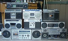 Radio-cassette players of the design also called "ghetto-blasters" and "boomboxes" Ghettoblaster-family.jpg