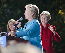 Clinton campaigning in Manchester, New Hampshire, in October 2016. New Hampshire Governor Maggie Hassan (left) and Massachusetts Senator Elizabeth Warren (right) in the background. Hillary Clinton Maggie Hassan Elizabeth Warren Manchester NH October 2016.jpg