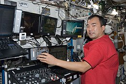 ISS-22 Soichi Noguchi at the Canadarm2 workstation in the Destiny lab.jpg
