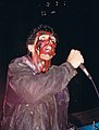 Singer Jaz Coleman in 1991, on stage in Chicago. In the background is bassist/producer Youth (Martin Glover)
