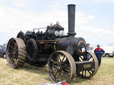 A John Fowler & Co. Ploughing Engine - the winding drum is mounted below the boiler (the 'drum' on the side is actually a hose for refilling the water tank).  A lockable tool box may be seen on the front axle; the 'spud tray' would be mounted in the same way, behind the axle.