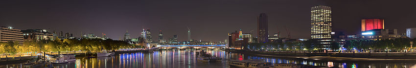 Facing east; towards the City of London, from Waterloo Bridge. Showing St. Paul's, and other major City buildings - to the right, the illuminated National Theatre. London's South Bank By Night.jpg
