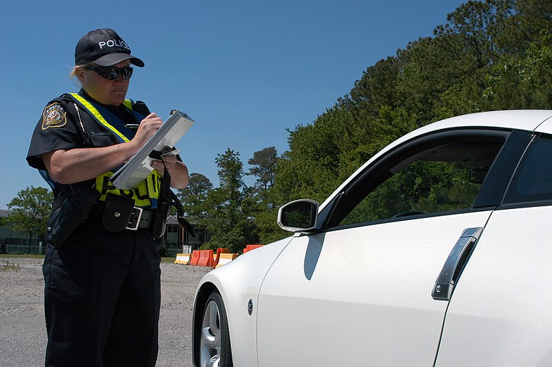 File:NABLC police officer ticketing a driver.jpg