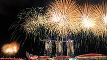 Fireworks over the Marina Bay skyline following the conclusion of the 2015 National Day Parade on 9 August 2015. NDP2015SG501.jpg