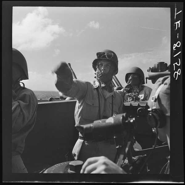 File:On board USS Lexington (CV-16) off Kwajalein. Marine gun captain points out JAP "Kate" moving in to launch torpedo. - NARA - 520797.tif