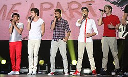 One Direction performing in Sydney. From left to right: Louis Tomlinson, Harry Styles, Liam Payne, Zayn Malik, Niall Horan,Moyo Picassa.