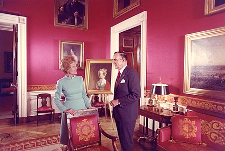 Pat Nixon with White House curator Clement Conger, whom she hired, in the Red Room after her redecorations, 1971