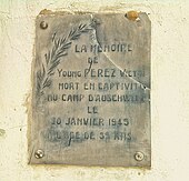 Plaque commémorative avec une inscription en français.