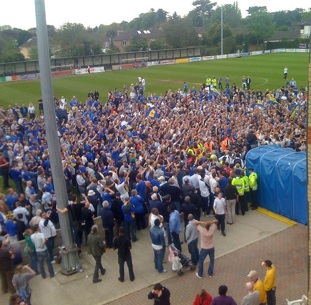 AFC Wimbledon fans and players celebrating promotion to the Conference South having beaten Staines Town 2–1 in the 2008 Isthmian League Premier Divisi