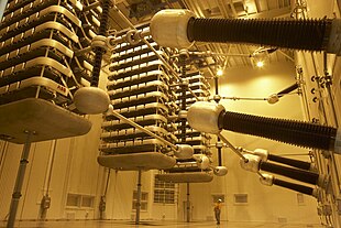 Thyristor valve stacks for Pole 2 of the HVDC Inter-Island between the North and South Islands of New Zealand. The man at the bottom gives scale to the size of the valves. Pole 2 Thyristor Valve.jpg