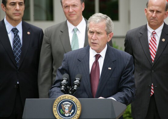 Issa watches President George W. Bush deliver remarks before signing the FISA Amendments Act of 2008