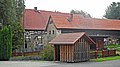 Residential stable house, side building and archway of a former three-sided courtyard