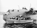 A RAAF work boat alongside a Sunderland flying boat