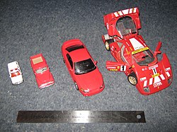 Die cast model cars in a variety of scales. Left to right: 1:64 Chevrolet Tahoe, 1:43 1953 Ford F-100, 1:25 1999 Ford Mustang Cobra, 1:18 1987 Ferrari F40. ScaleCarComparison.jpg