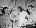 Scientists Robert Meigs and Clarence Pautzke checking over the equipment they will use at Bikini, probably on board the USS (DONALDSON 27).jpeg