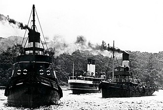 Curl Curl ran aground at Bradleys Head in thick fog, 1936. Tugs St Aristel and Lindfield pulled her off. Sydney ferry CURL CURL aground at Bradleys Head with tugs ST ARISTEL and LINDFIELD 31 March 1936.jpg