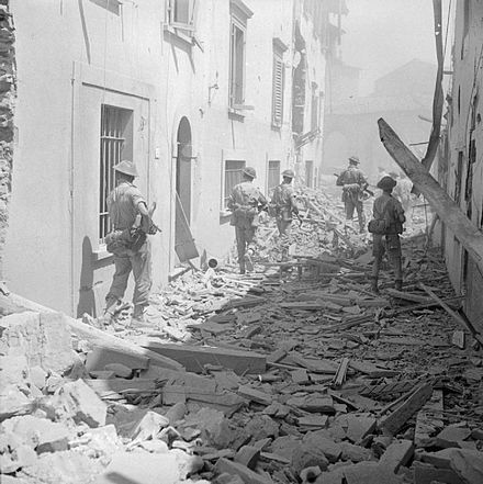 British infantry moving cautiously through the ruined streets of Imprunetta, 3 August 1944 The British Army in Italy 1944 NA17570.jpg