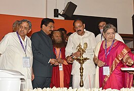 The Vice President, Shri M. Venkaiah Naidu lighting the lamp at an event to inaugurate centenary celebrations of The Yoga Institute, in Mumbai.jpg