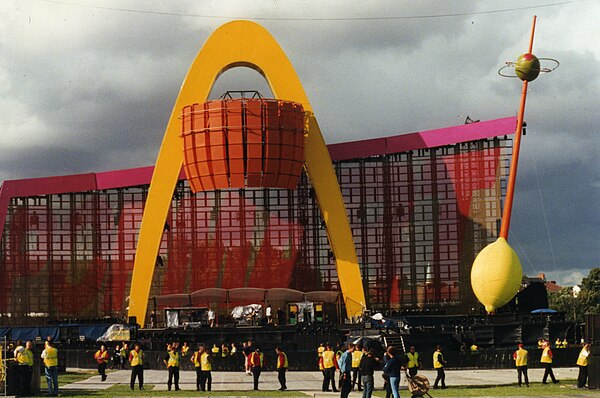 The PopMart Tour stage featured the largest LED screen ever at the time, along with a golden arch, mirrorball lemon, and olive on a toothpick.