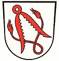 Gemeinde Thüngfeld In Silber eine schräg gestellte rote Pferdebremse über einem verschlungenen, geflochtenen roten Lederseil.[39]