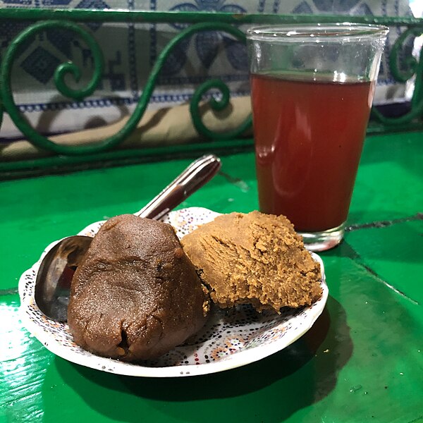 Khudenjal, an herbal tea based on Alpinia officinarum, and two types of sellou at Jemaa el-Fnaa in Marrakesh.