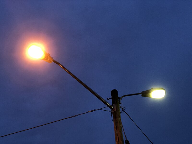 File:2023-09-07 19 36 29 Sodium-vapor (left) and mercury-vapor (right) street lights on utility pole 5272EW in an alley adjacent to Winthrop Avenue in the Parkway Village section of Ewing Township, Mercer County, New Jersey.jpg