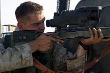 US Marine Corps Reserve (USMCR) Lance Corporal Ivey, Surveillance and Target Acquisition Platoon, 3rd Battalion, 23rd Marine Regiment (3/23), sites through the AN/PVS-10 Day/Night Vision Sniper Scope atop his 7.62mm M-40 (Remington 700) sniper rifle, following a "shots fired" incident near Al Kut, Iraq, 2007. 3 23 sniper 2007.jpg