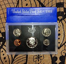 A 1969 United States Mint Proof set of 5 coins including the 40% silver Kennedy half dollar in centre A 1969 United States Mint Proof Set.jpg